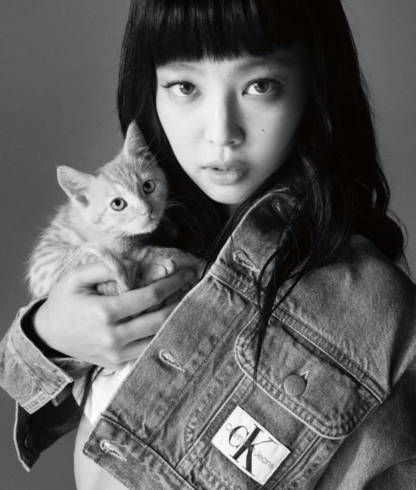 A person holding a catDescription automatically generated with medium confidence